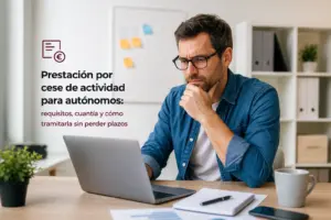 Homem pensativo com óculos trabalhando no laptop sobre finanças